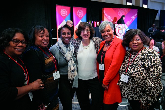President Martha E. Pollack, center, surrounded by just a few of the more than 1,000 alumni, parents and friends who attended the Cornell event at the museum in November 2017.