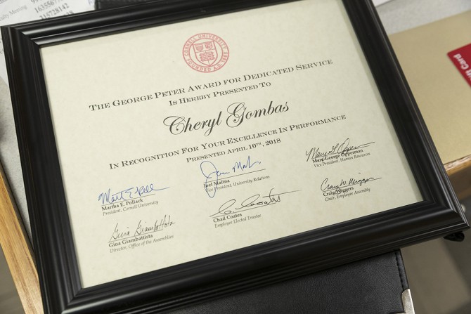 framed copy of the George Peter Award for Dedicated Service certificate