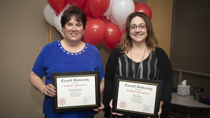  Josephine Hagin and Lisa E. Rose are recognized for 25 years of service.