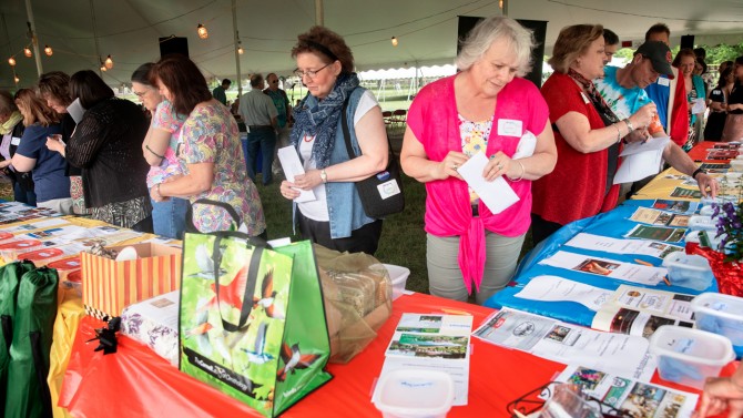 Staff submit tickets for prizes at the 2018 Arts and Sciences picnic.