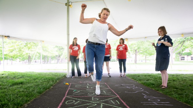 Staffers participated in games popular in the ’60s: a hula-hoop contest, badminton, dart toss and hopscotch.
