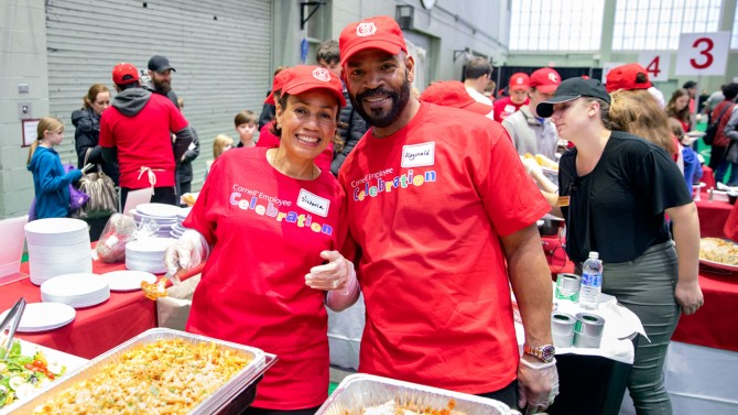 Victoria and Reginald White serve up chicken parmesan and pasta at the 2019 Winter Employee Celebration Feb. 16.
