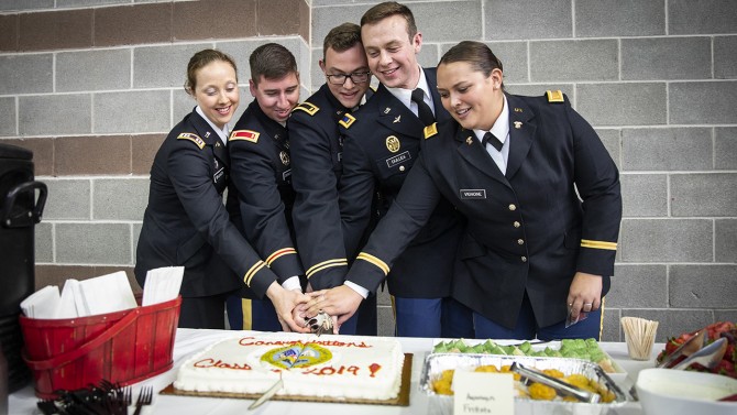 New officers cut cake