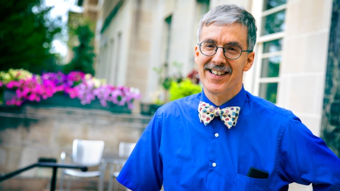 Man in blue shirt with bow tie