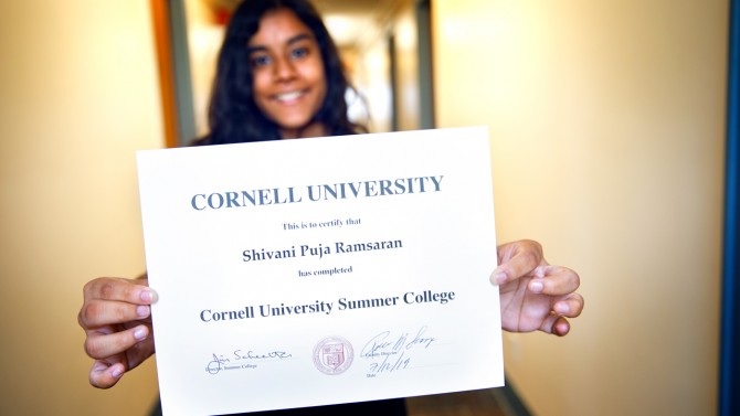 Student Holding up a Certificate 