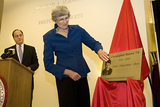 Christopher Reeve's mother, Barbara Johnson, unveils the plaque dedicated to her son at the Schwartz Center for the Performing Arts, Nov. 18, while John Foote, president of the Class of 1974, looks on.