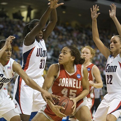 Jeomi Maduka is swarmed by University of Connecticut players