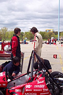 Standing are the two Cornell skid-pad drivers