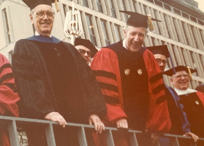 Rhodes greets graduates from the reviewing stand during the 1979 Commencement procession