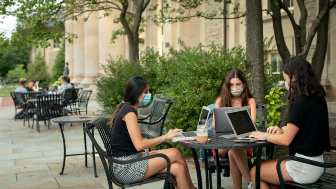 Students work together outside Goldwin Smith Hall during the first day of classes.