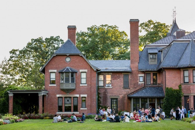 A.D. White House with people sitting on the lawn