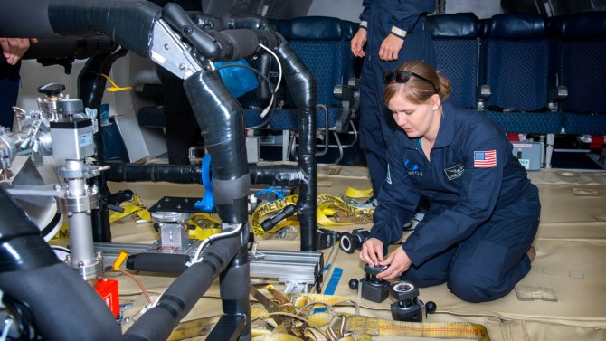 Laura Jones-Wilson, Ph.D. ’12, prepares a microgravity experiment to gather data on magnetic flux pinning.