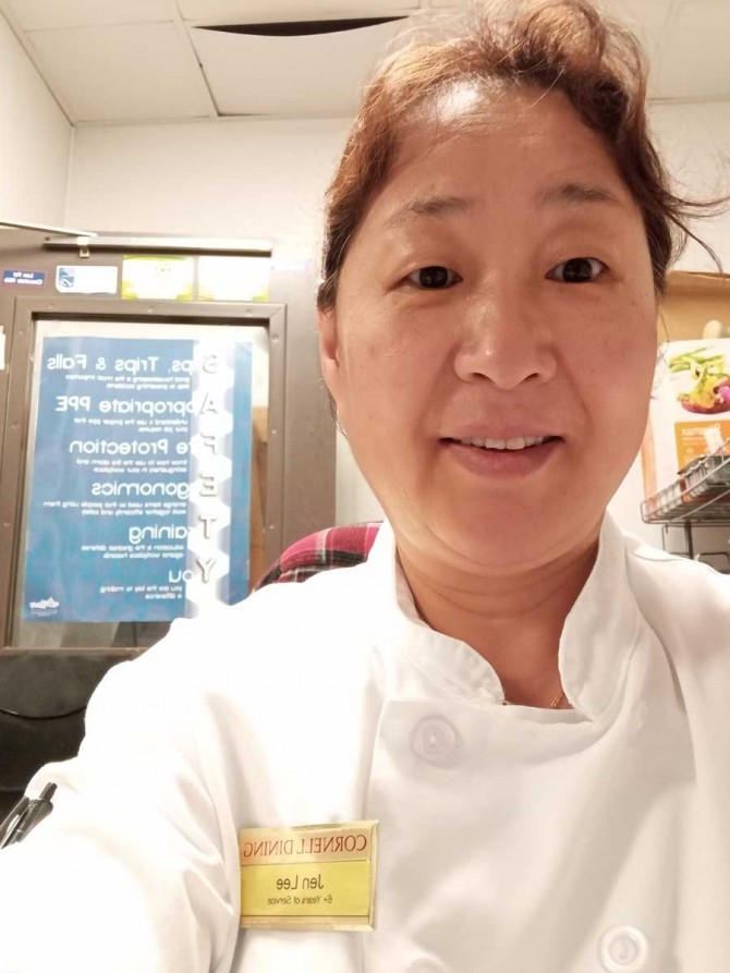 Jungae “Jen” Lee takes a selfie in a kitchen