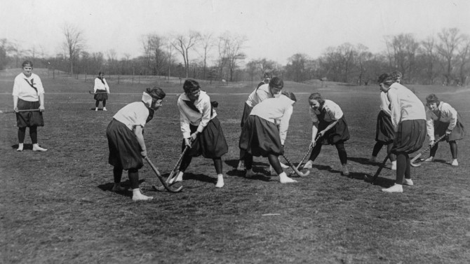 A group of Cornell women compete in field hockey in 1919.