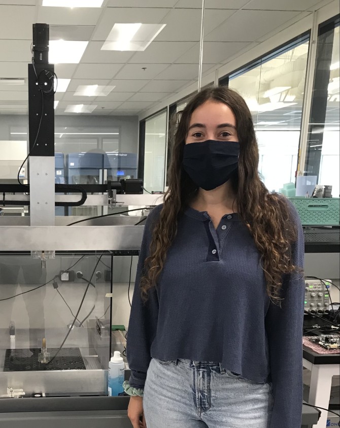 Emma Kranich wears a mask in a lab setting at iota Biosciences.