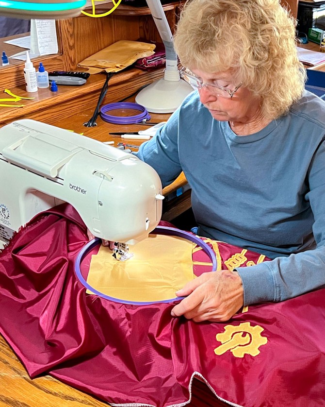 Linda Lambert works on the new ILR banner.