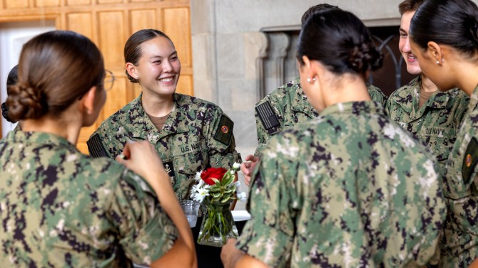 Members of Cornell’s military community chat at the reception.