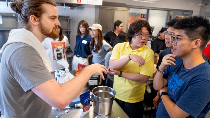 Andy Kalenak speaks with club members about the beer-making process.