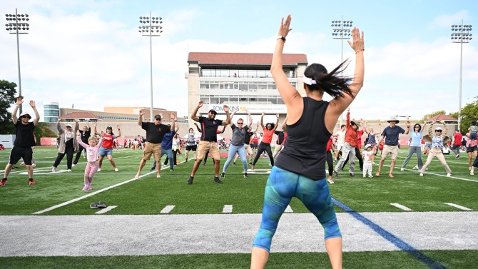 Staff and members of the Cornell community dance along with a Zumba instructor during the 11:15 a.m. session.