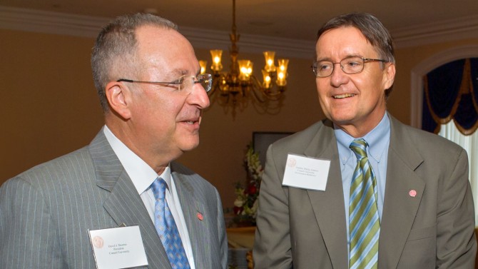 Steve Johnson, center, vice president for government affairs, who had a genial approach to legislators and other officials, holds a discussion with Cornell President David J. Skorton, left, in 2006. Johnson died Sept. 30 in Syracuse.