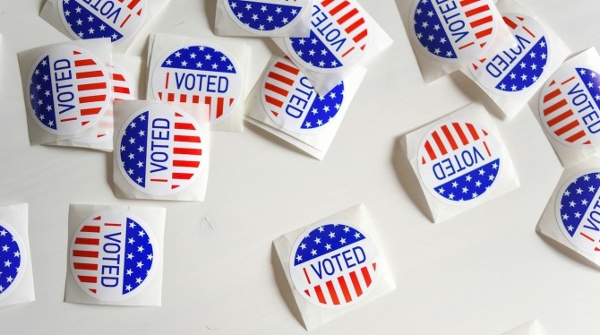 "I Voted" stickers scattered across a table.