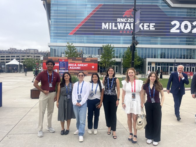 Students pose in front the entrance to the 2024 RNC Convention Center in Milwaukee