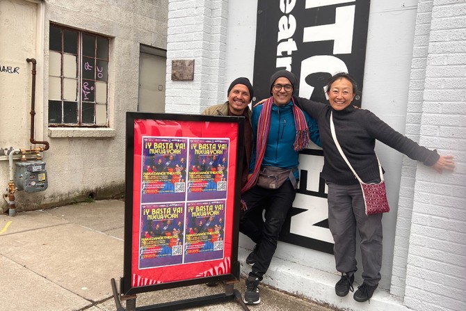 Three people pose in front of Ithaca's Kitchen Theatre building