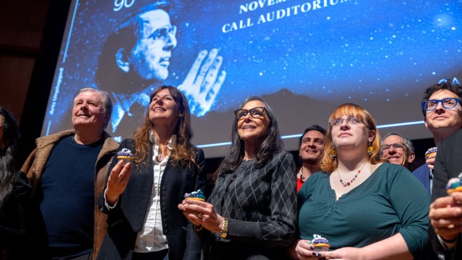 Presenters and attendees enjoyed “planetary cupcakes” during a break in “Carl Sagan’s 90th Birthday: A Celebration” on Nov. 9 in Call Auditorium. At center, Ann Druyan, Sagan’s widow, stands next to Carl Sagan Institute Director Lisa Kaltenegger, second from left.