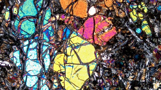 A polarized microscope photo of basaltic rock.