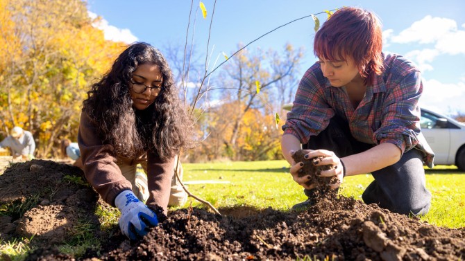 Students in the Cornell Botanic Gardens' Learning by Leading program work on the new medicinal garden at Onondaga Nation School in Nedrow, New York.