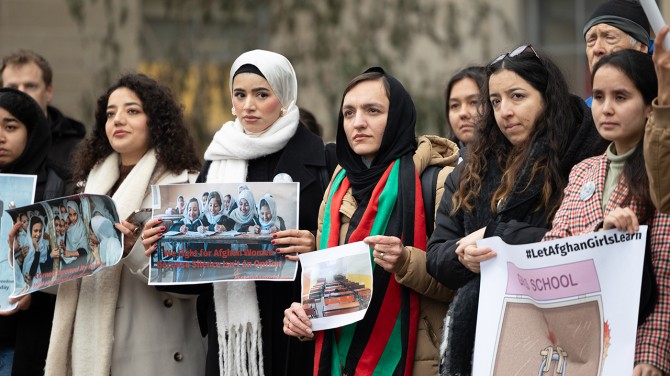 Zarifa Ghafari (center) rallies to raise awareness of the plight of Afghan girls and women living under the Taliban, on Dec. 9 outside Day Hall.