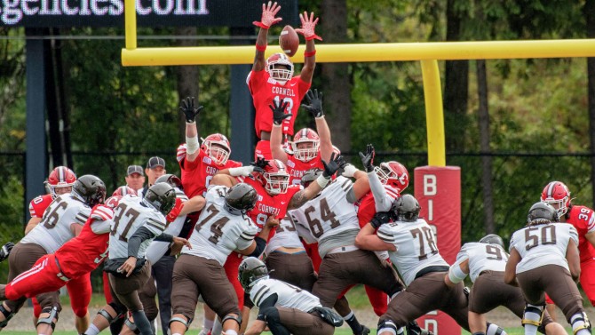 Jalyx Hunt leaps to block a kick during a game against Brown.