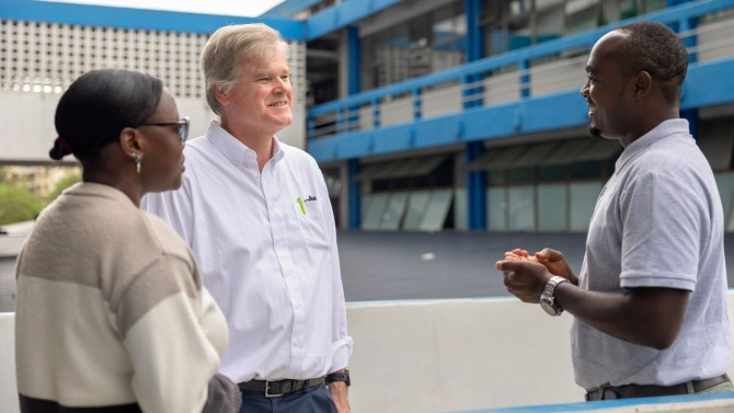 At center, Dr. Daniel Fitzgerald, director of Weill Cornell Medicine's Center for Global Health, chats with Dr. Grace Ruselu, left, and Dr. Godfrey Kisigo, right, at Bugando Medical Centre in Mwanza, Tanzania.