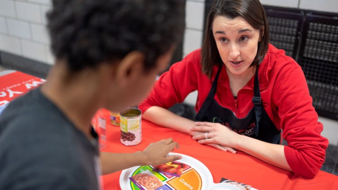 Melissa Kimbrell, SNAP-Ed New York regional coordinator with CCE Erie County, talks about nutrition and healthy meals with the students of West Hertel Academy in Buffalo.