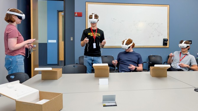 Interns at Cornell NanoScale Facility use the virtual reality youth outreach module, designed to prepare the next generation of students in cutting-edge microchip fabrication, at Duffield Hall. From left, Elyas Talda, Scott Coonrod ’28, Porter Rowbotham and Nikolas Wheeler.