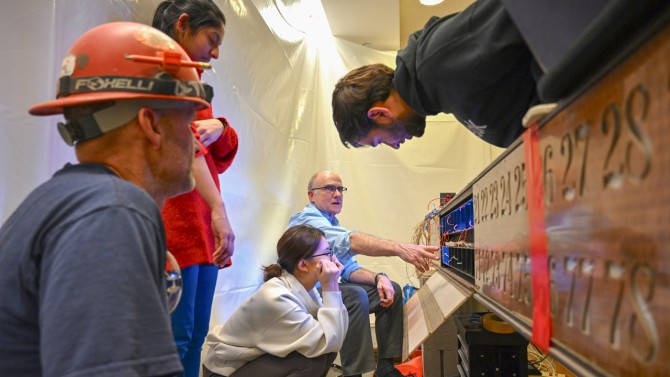 Joe Skivora, Ph.D. ’90, (center) and his engineering students installed a computer, used new multicolored LED lights to replace the old incandescent bulbs, and reused as much of old the wiring as possible.