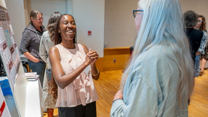 Mia Wangari Adriko ’26 (left) shared details on the statewide curriculum framework she developed to help 4-H fulfill its mission of inspiring the next generation of food systems leaders