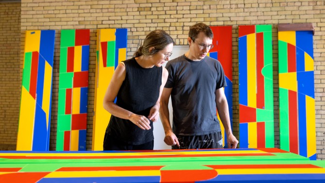 Michael Jefferson and Suzanne Lettieri, faculty in the Department of Architecture and co-principals of Jefferson Lettieri Office, inspect pieces of “Apart, Together” during its fabrication on campus.