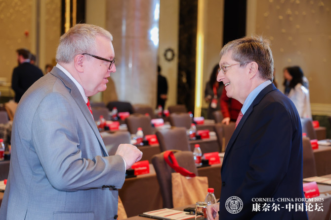 Dean Lorin D. Warnick speaks with Jeffrey Lehman, former Cornell president, at the Cornell-China Forum.