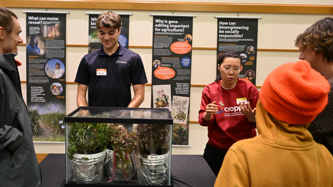 Graduate Student Jacob Belding and Postdoctoral Associate Tian Li present RedAlert Living Sensors, genetically engineered tomato plants that turn red to indicate a lack of nitrogen in the soil.