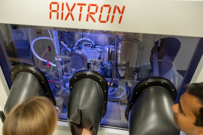 closeup of MOCVD system with "aixtron" written at top