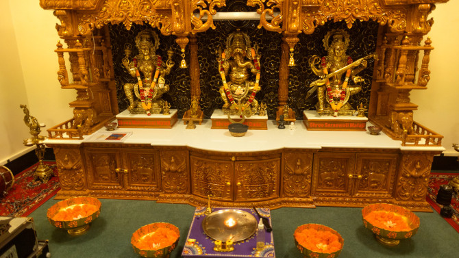 The new Hindu temple room on the second floor of Anabel Taylor Hall offers a place to pray, meditate, gather and house Hindu murtis – golden idols that embody gods and goddesses.