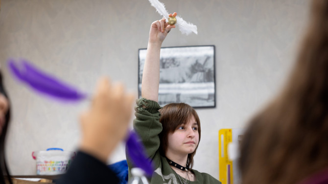 McKenna McConnell, 15, shares her Quidditch snitch at a Cornell Cooperative Extension program for homeschoolers on Nov. 18.  