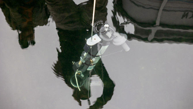 The research team dropped sampling equipment inside and outside pockmarks on the floor of Seneca Lake, looking for sources of methane and chloride.