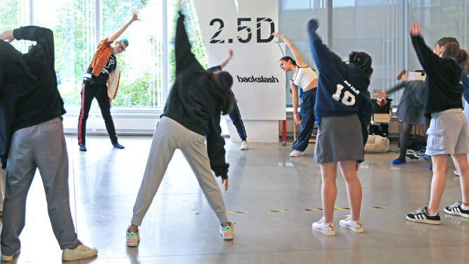 Spence Ray, director of the K-12 Lab at Cornell Tech, leads a movement and coding workshop with students from The Young Women's Leadership School on campus.