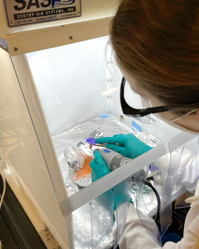 Gerdes drills the exterior off a ceramic sample at the Cornell Center for Materials Research.