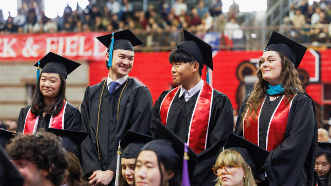 Graduates stood as their degrees were conferred by the deans of each college and President Kotlikoff.
