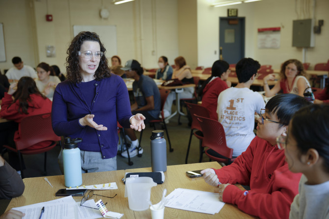 professor speaks to two students