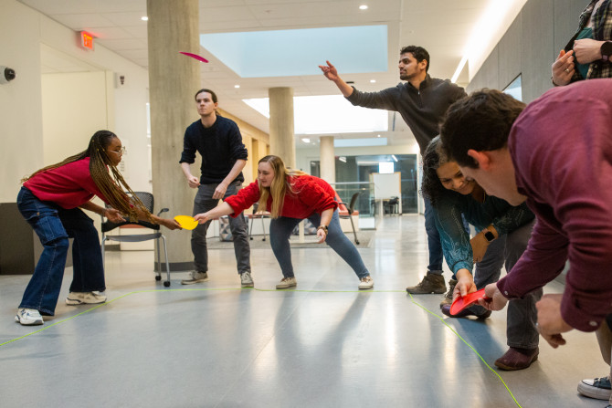 six people pass objects around