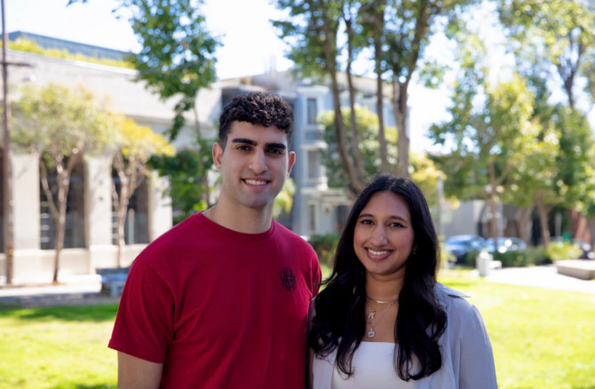 two people standing outside